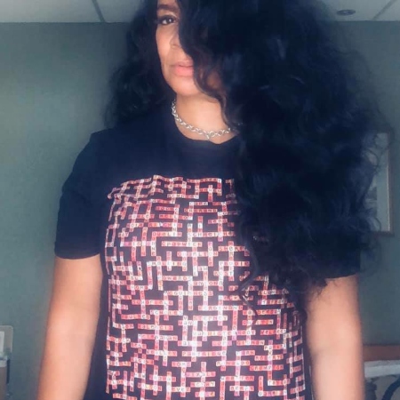 photo of rowetta wearing manchester bands name-chains black t-shirt