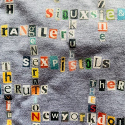 image of close up of grey punk/new wave name-chains t-shirt