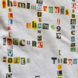 image of close up of white punk/new wave name-chains t-shirt